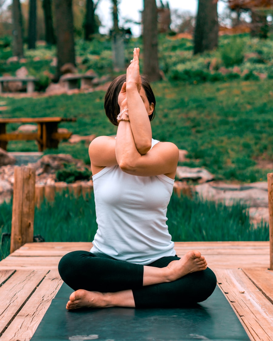 Woman practicing yoga outdoors